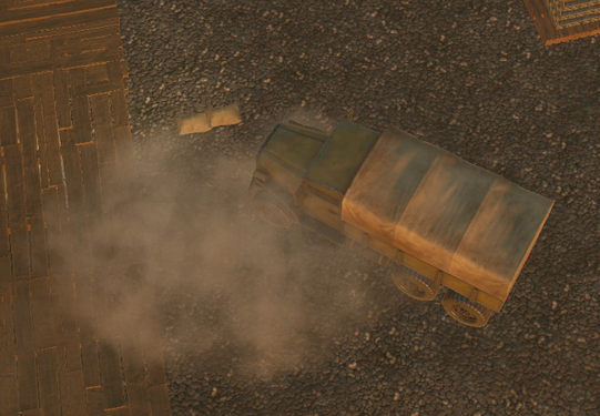 A truck runs over and destroys a sandbags wall, leaving some sandbags materials on the ground.